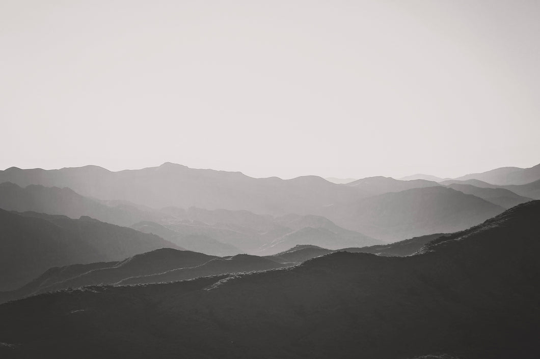 MOUNTAINS LAYERED AT SUNSET POINT IN BLACK & WHITE
